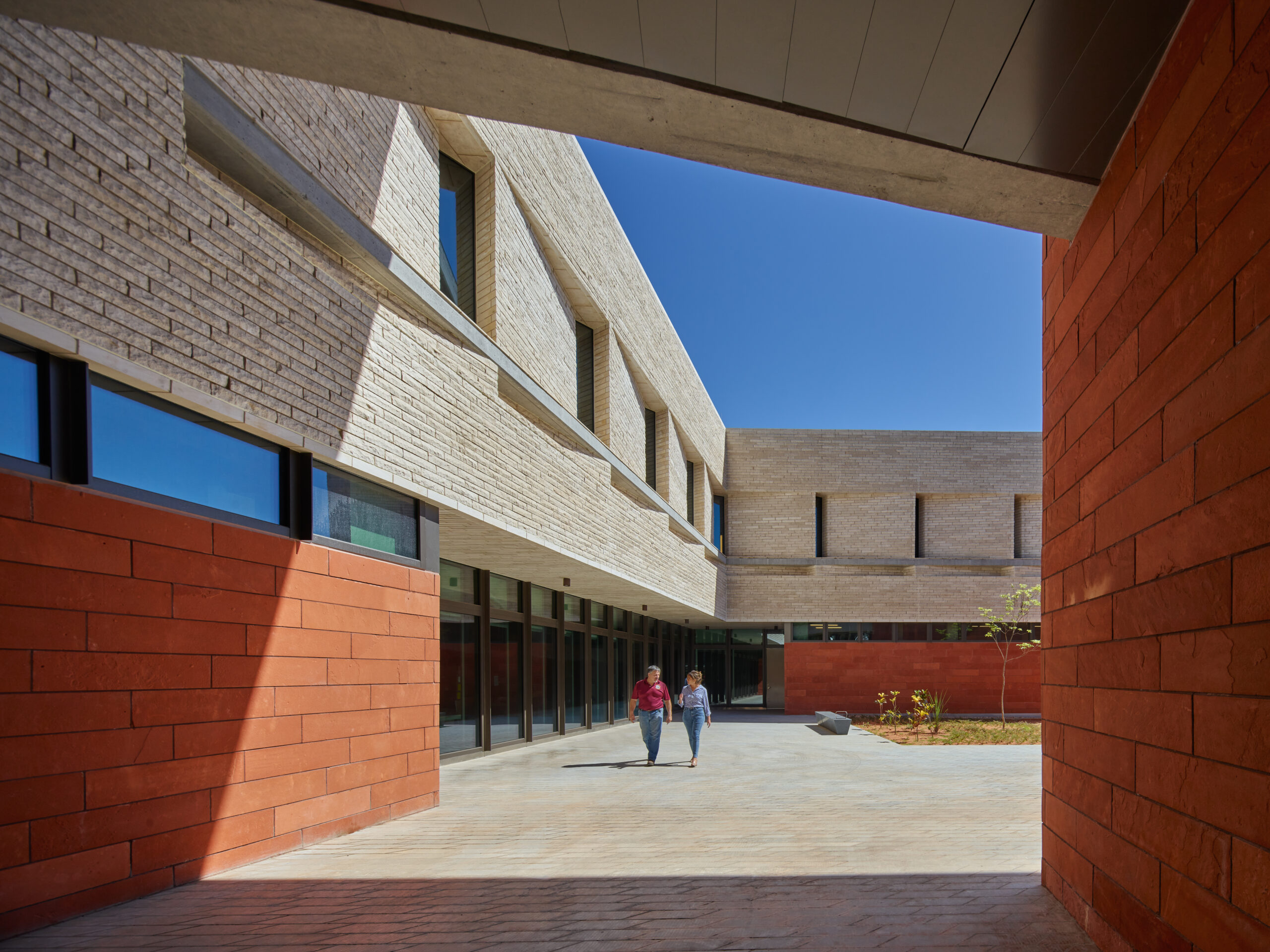 Concrete canopies and bridges provide shaded paths parallel with the length of the site