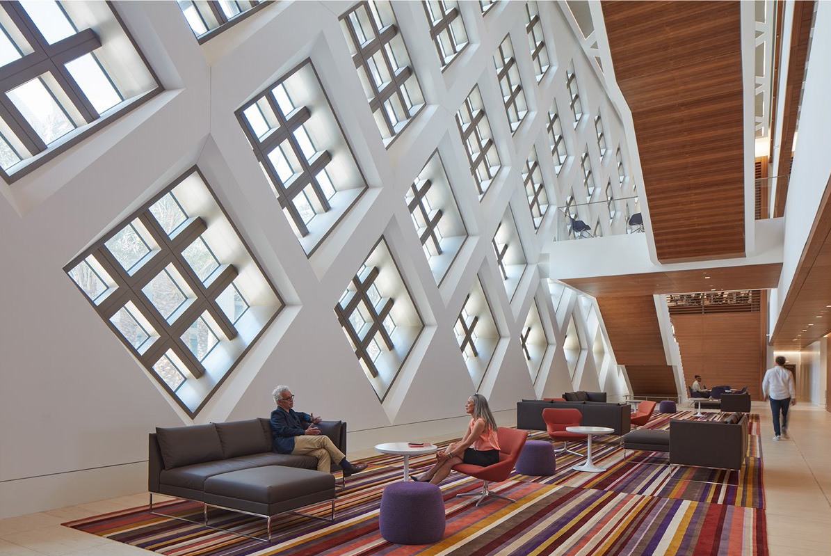 View of the gallery space and sculptural stair connecting three levels of work space.